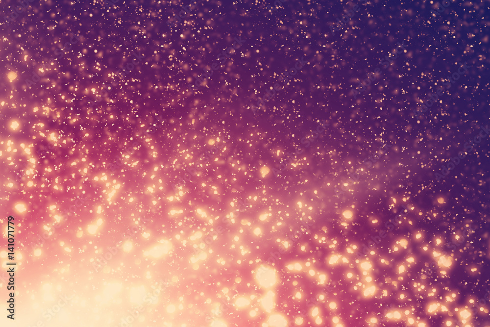 Golden rays and sparkles or glitter lights. Merry Christmas festive black background.defocused circle bokeh or particles Golden rays and sparkles or glitter lights. Merry Christmas festive black background.defocused circle bokeh or particles