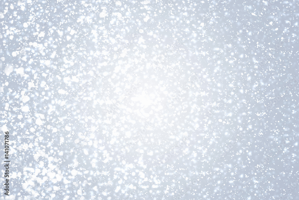 Snowflakes  and bokeh or glitter lights on silver background. Christmas abstract template