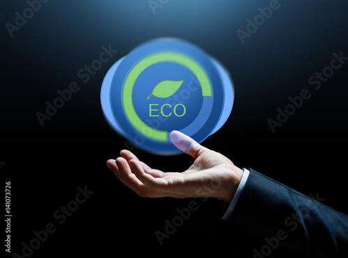close up of businessman hand with eco icon