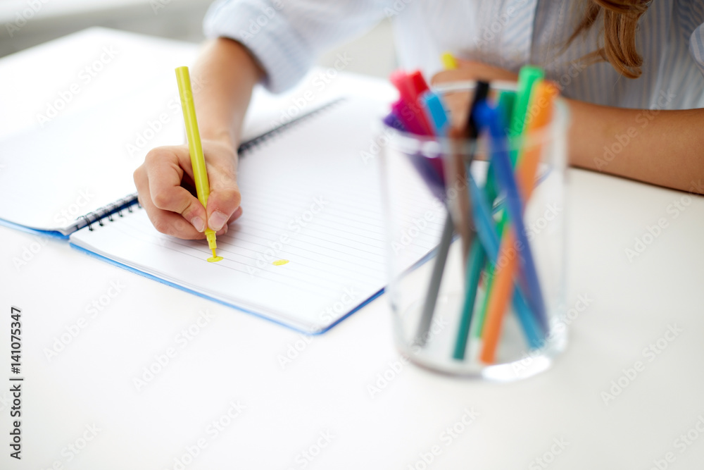 girl drawing with felt-tip pen in notebook girl drawing with felt-tip pen in notebook