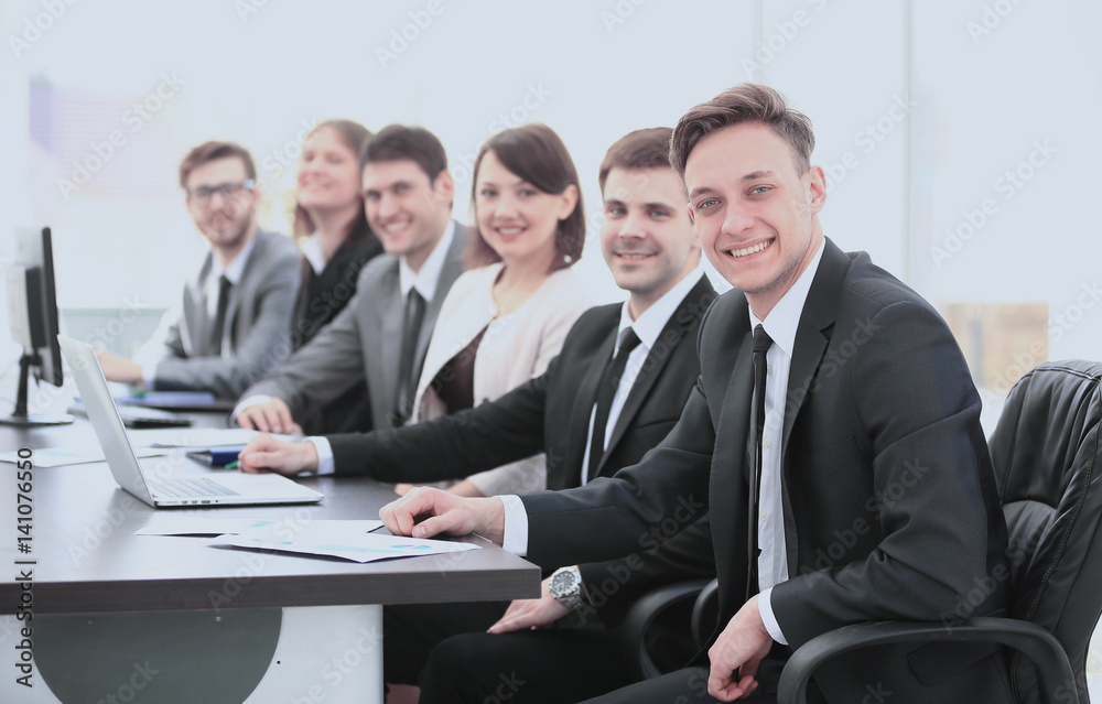 company's shareholders at a meeting at work, sitting at a table company's shareholders at a meeting at work, sitting at a table