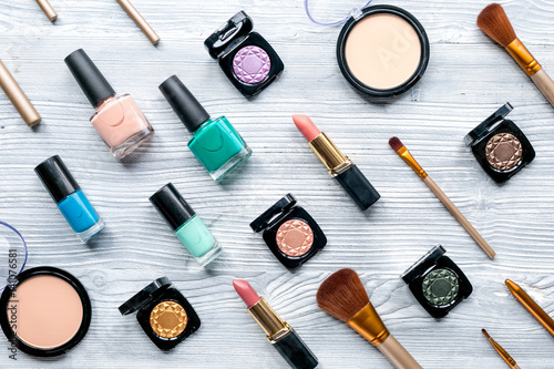 Beauty and fashion concept with decorative cosmetics on table background top view