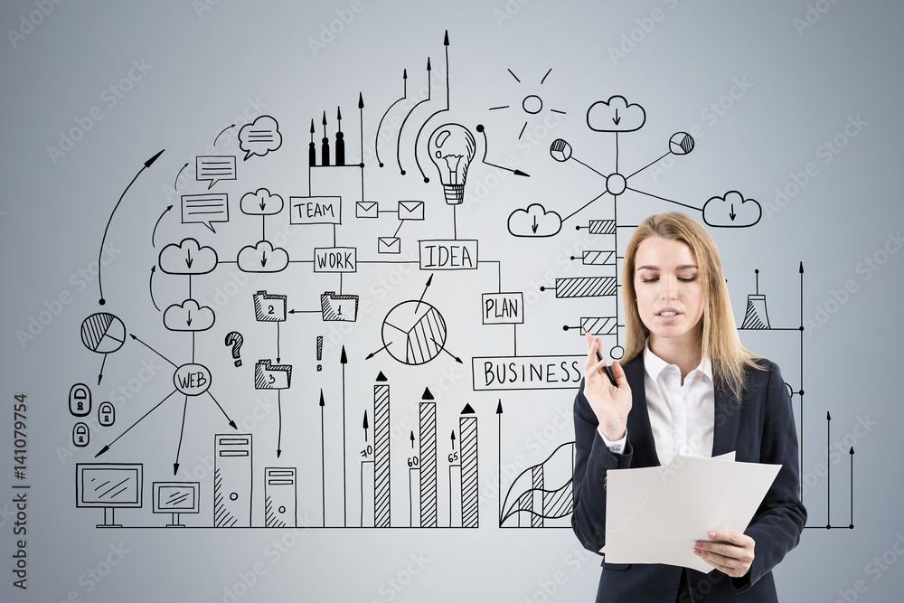 Woman with papers and business scheme on gray Woman with papers and business scheme on gray