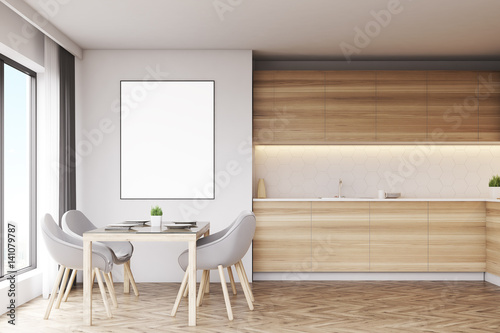 Light wood kitchen with table and poster