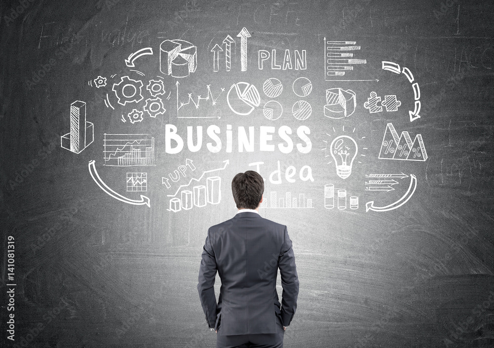 Rear view of man considering business idea Rear view of man considering business idea
