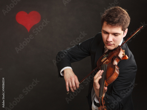 Obraz na płótnie Man man dressed elegantly playing violin
