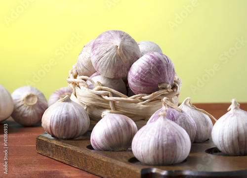 Fresh spicy garlic on a wooden table, macro