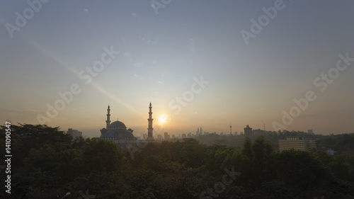 a beautiful sunrise or sunset view of The Federal Territory Mosque in Kuala Lumpur  Malaysia