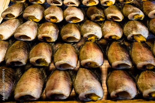 Dried salted snake skin gourami fish on Thailand market photo