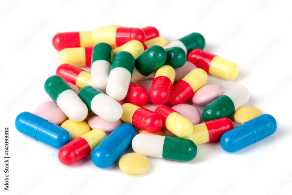 pile of colorful pills isolated on white background pile of colorful pills isolated on white background