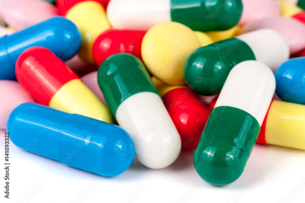 colorful pills isolated on white background colorful pills isolated on white background