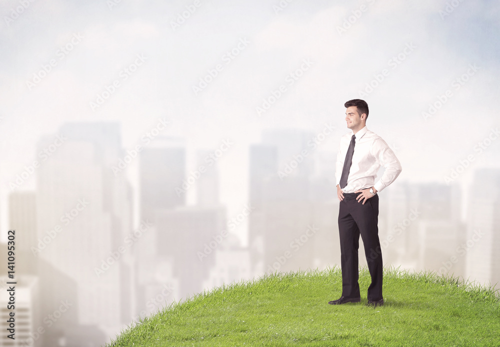 man standing in front of city landscape man standing in front of city landscape