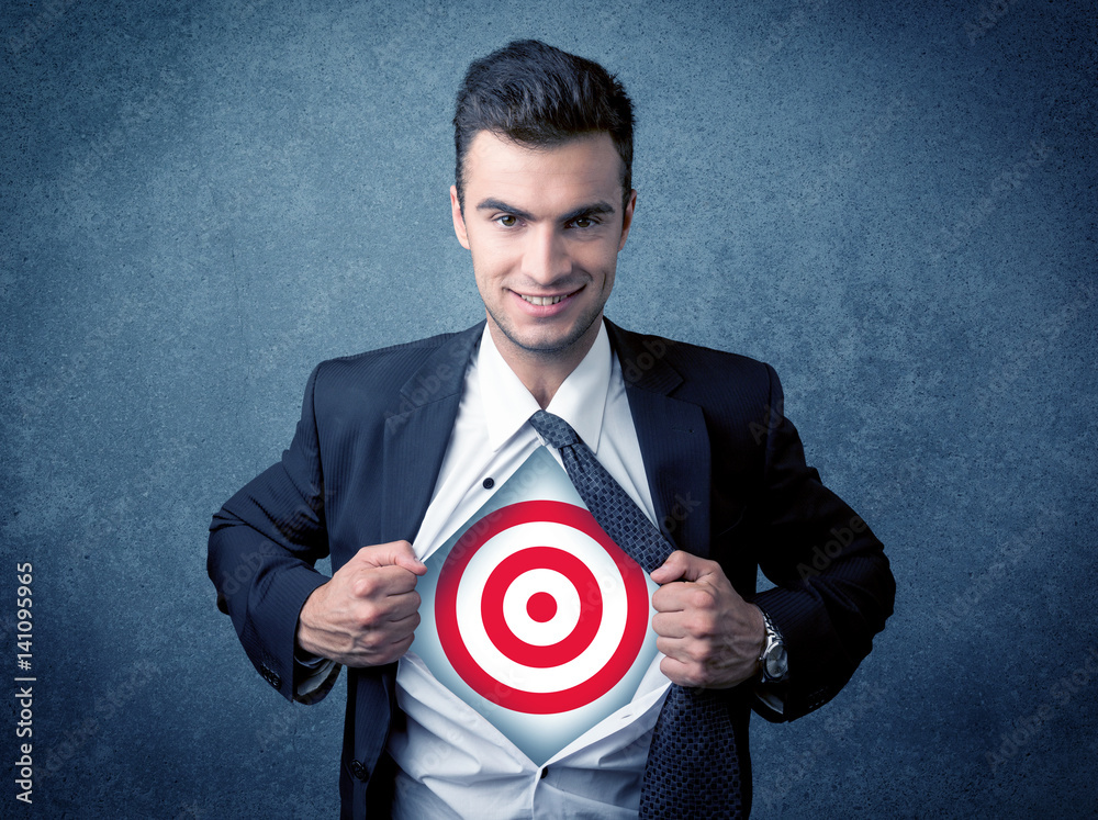 Businessman tearing shirt with target sign on his chest Businessman tearing shirt with target sign on his chest