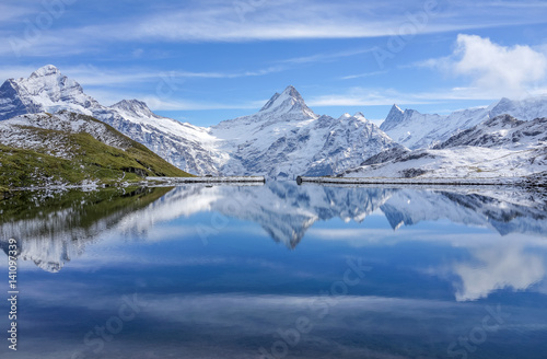 The snow mountain with reflection in lake and clear blue sky in Switzerland © Nuthawut