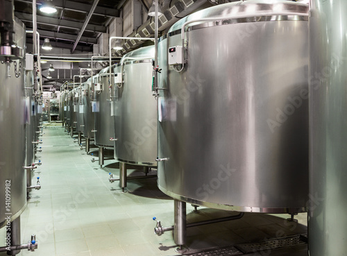 Rows of steel tanks for beer fermentation and maturation.