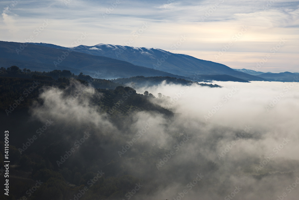 Sea of fog filling a valley Sea of fog filling a valley