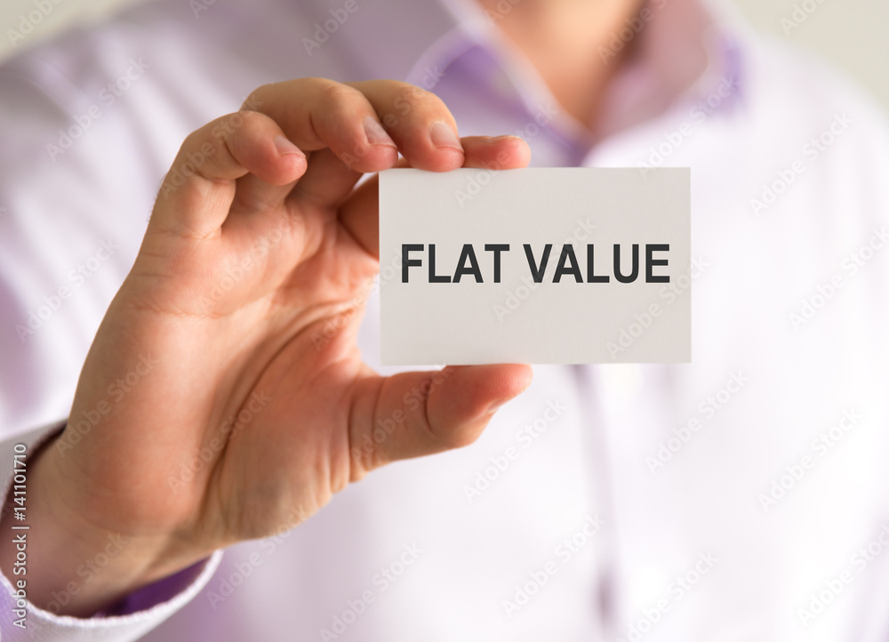 Businessman holding a card with FLAT VALUE message Businessman holding a card with FLAT VALUE message