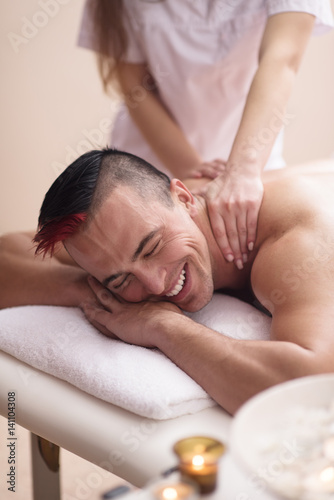 young man having a back massage