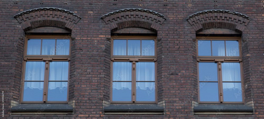 Three vintage front glass windows of an old house