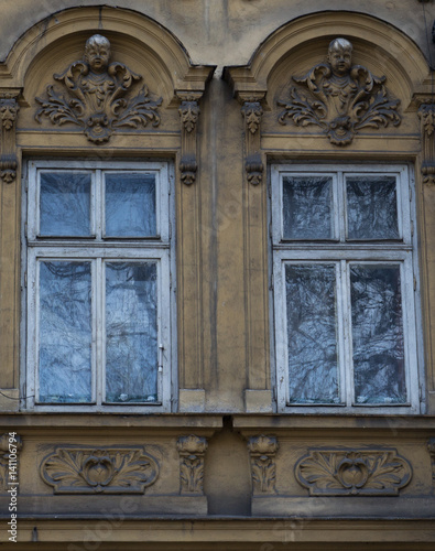 Two vintage front glass windows of an old house © Bogdan