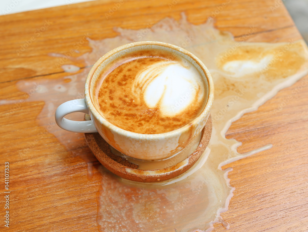 Coffee spilled on the wood table Coffee spilled on the wood table