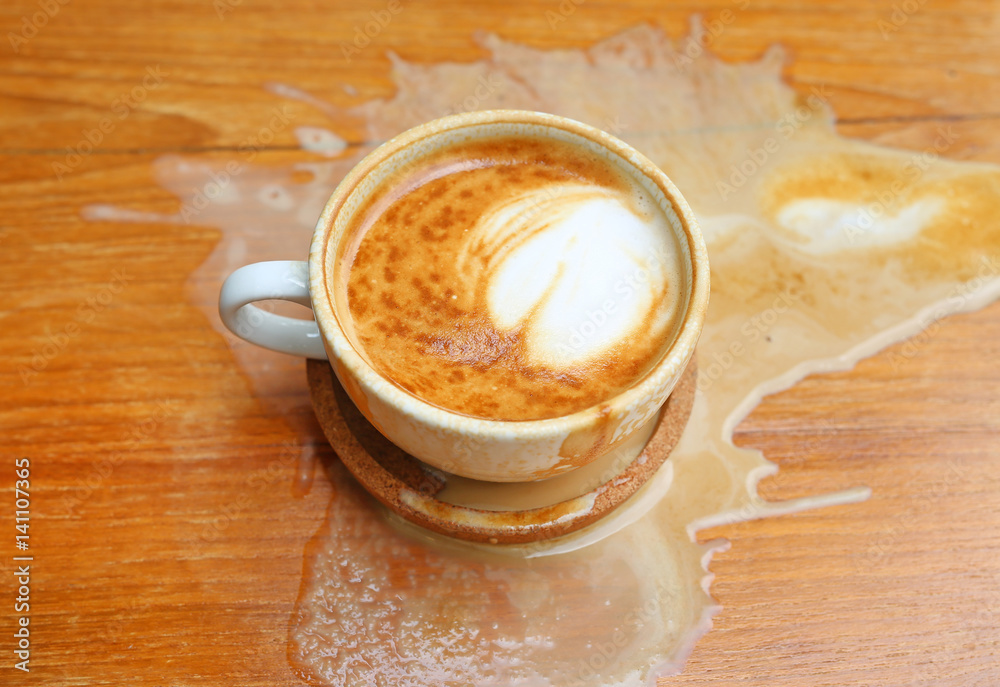 Coffee spilled on the wood table Coffee spilled on the wood table