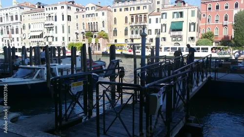 Gondolas wallow moored at the berth in the Grand Canal photo