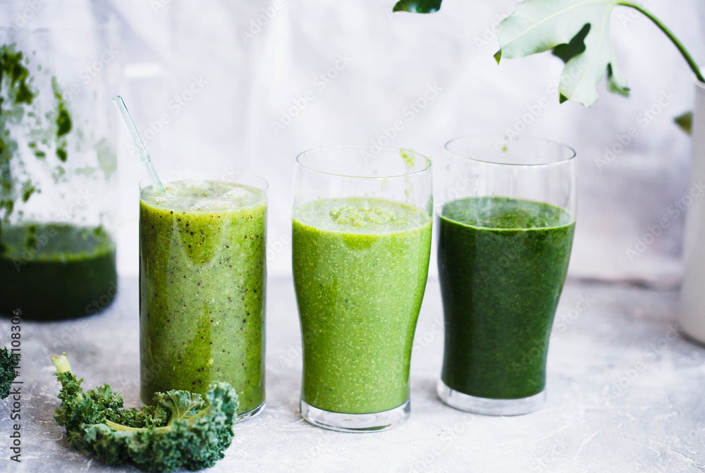 Group of Green smoothie with green fruits and vegetables. Green smoothie glass. Detox, dieting, clean eating, fitness diet concept. Group of Green smoothie with green fruits and vegetables. Green smoothie glass. Detox, dieting, clean eating, fitness diet concept.