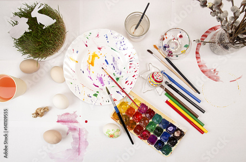 Painting Easter eggs with watercolor and markers. photo