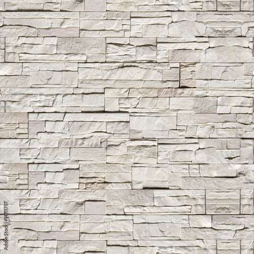 Seamless texture wall light gray stone wild fence