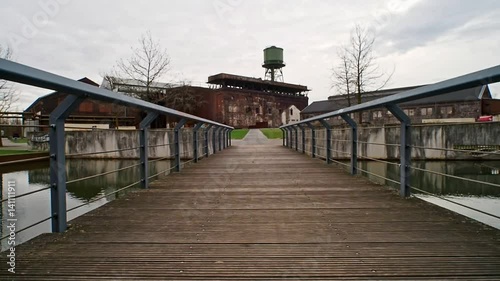 Bridge to an old factory photo