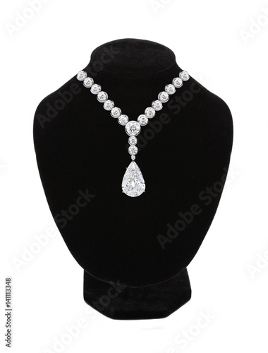 Diamond necklace on black mannequin isolated on white