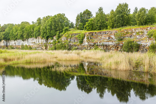 Fototapeta Naklejka Na Ścianę i Meble -  Water pond in an abandoned open pit mining