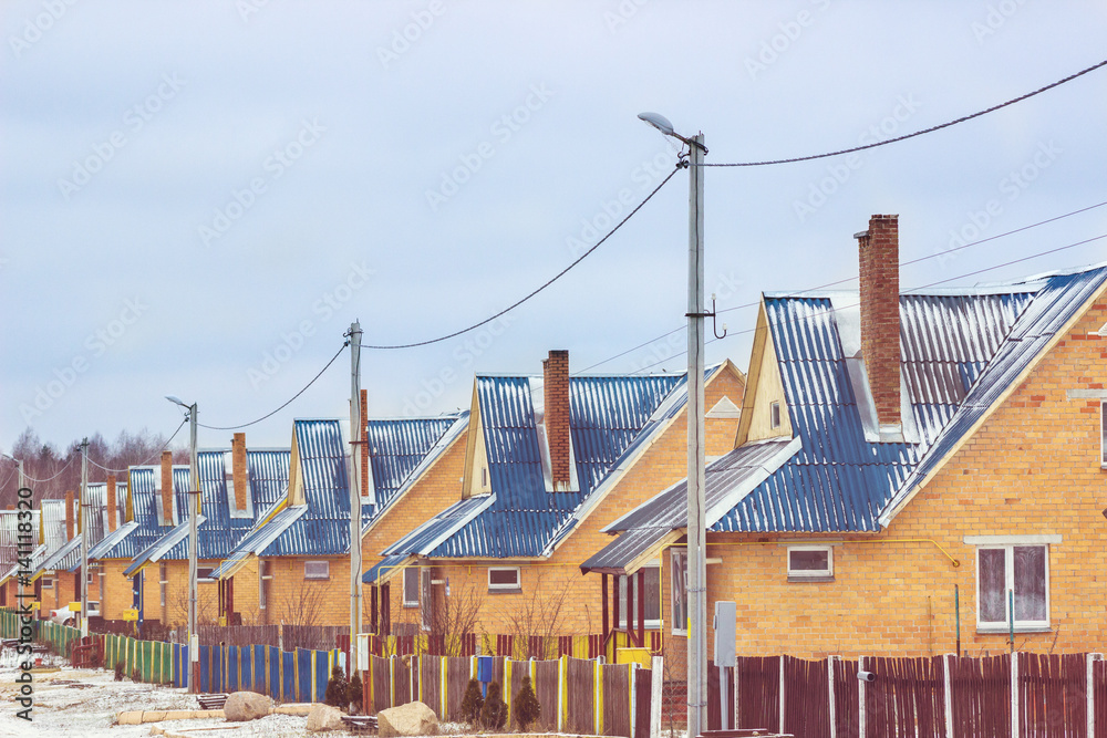 Obraz premium Street in the village with the same houses