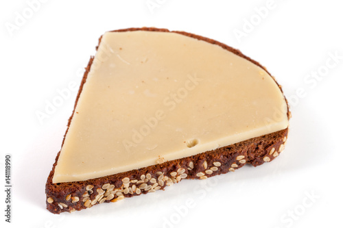 slice of black bread with sesame seeds with cheese isolated on white background