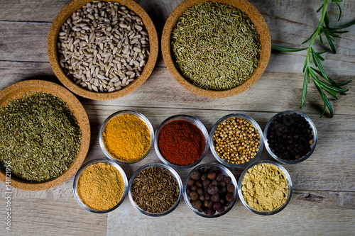 Various colorful spices on wooden table. closeup. place for typography