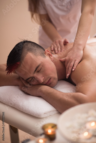 young man having a back massage