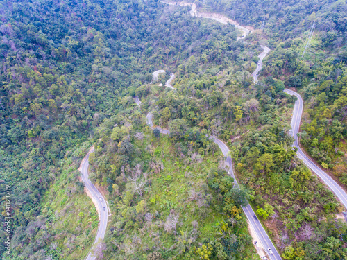 Beautiful Scenic Serpentine Road in Forest on Mountain