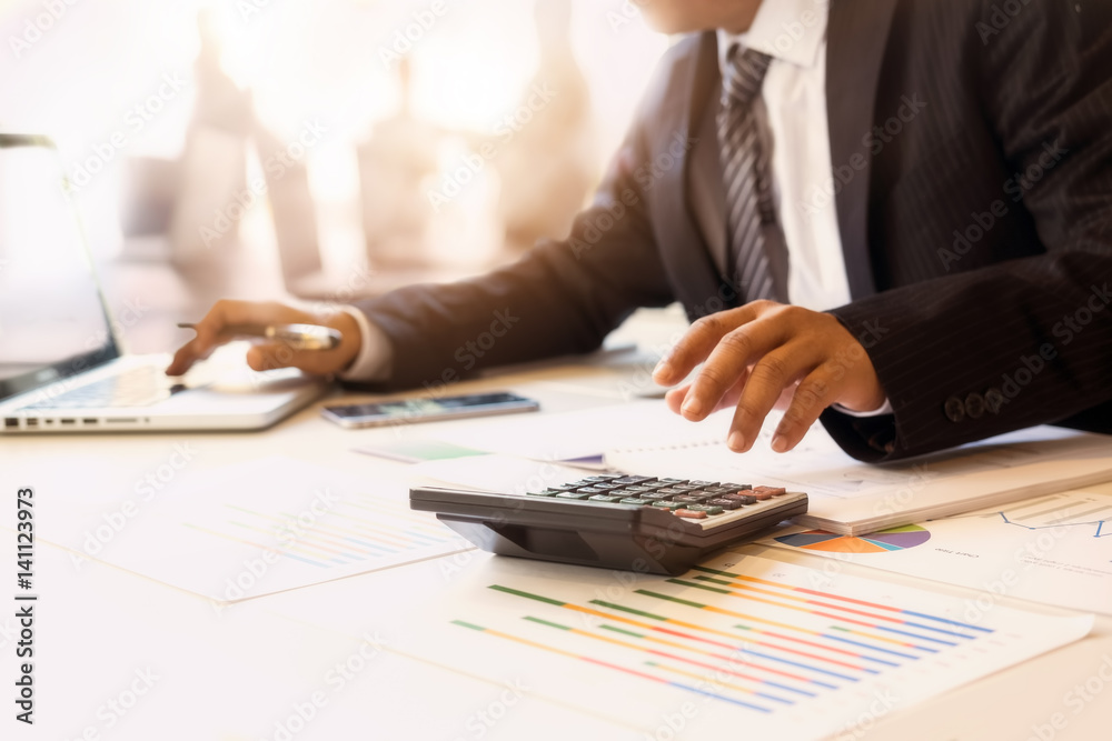 Businessman Working with charts data in office. Businessman Working with charts data in office.