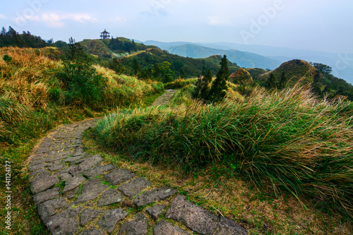 Qixing Trail and a distant gazebo on Yangming Mountain in Taiwan photo