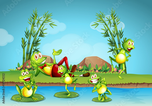 Fototapeta Naklejka Na Ścianę i Meble -  Five frogs living by the pond