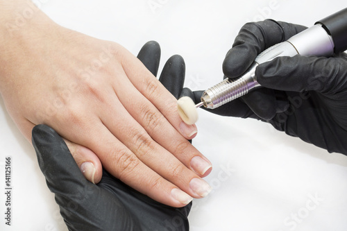 Woman doing manicure beauty salon 