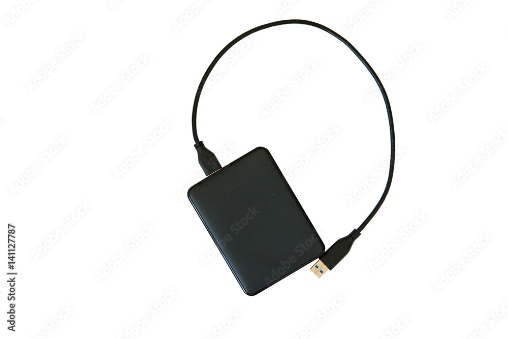 Black hard drive with cord for computer on white background closeup top view Black hard drive with cord for computer on white background closeup top view