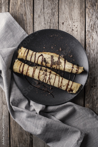 above view of chocolate crepes on a plate