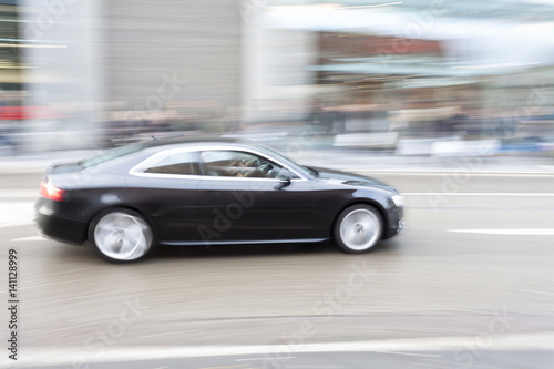 Car in motion blur  car driving fast in city