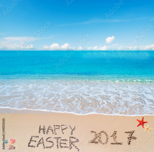 happy easter 2017 on a tropical beach under clouds