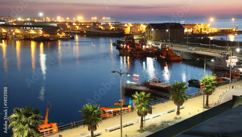 view of the harbor of vigo city at night with illumination