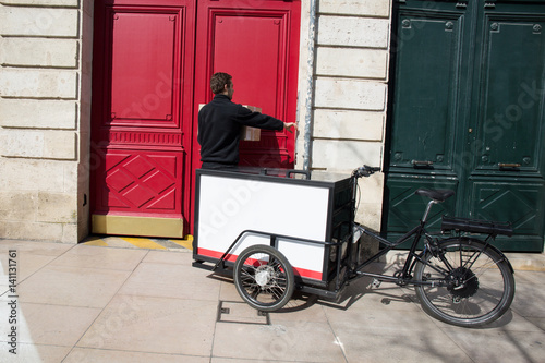 Delivered of packages by cycling courier photo