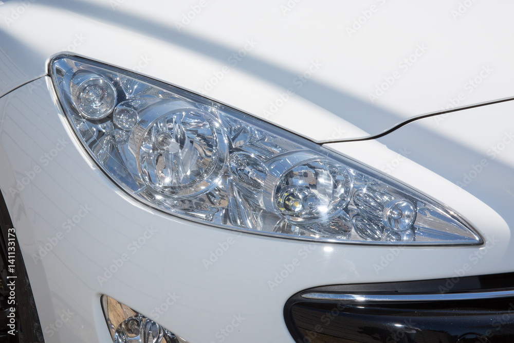 white headlight of a modern car