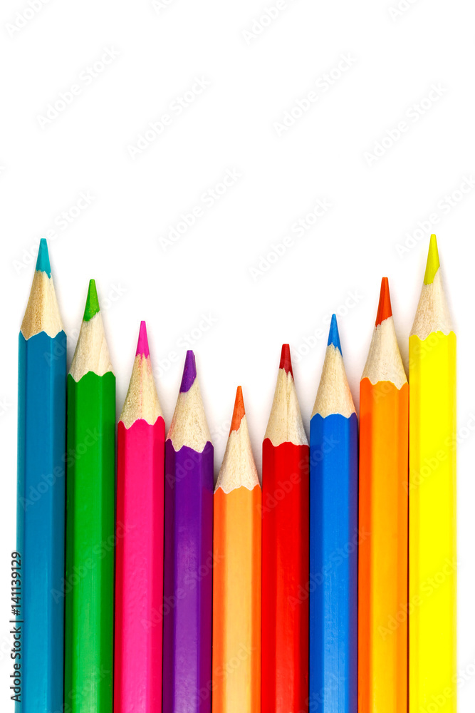 Set of colored pencils on a white background, arrangement with an internal corner Set of colored pencils on a white background, arrangement with an internal corner